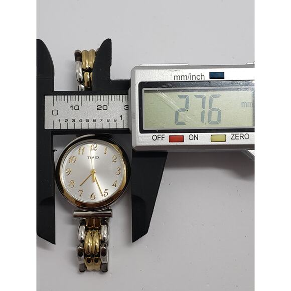 Women\'s Timex dress watch. Silver/white iridescent face. Two tone band